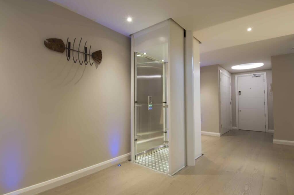 A personal elevator installed along the wall of a home