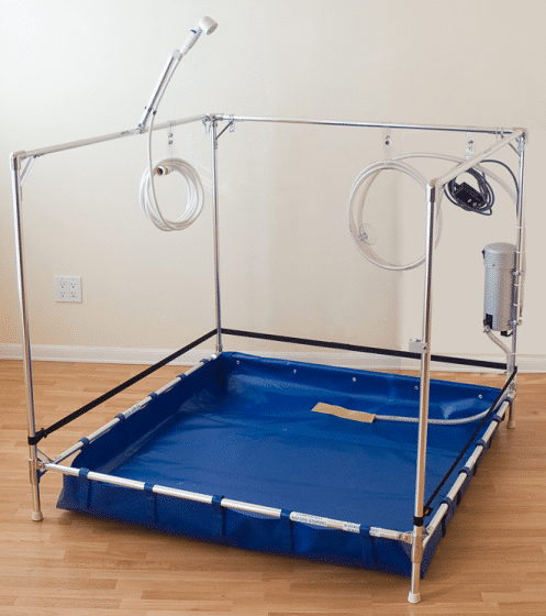Portable, collapsible shower stall with chrome frame, blue basin, detachable showerhead, and pump.