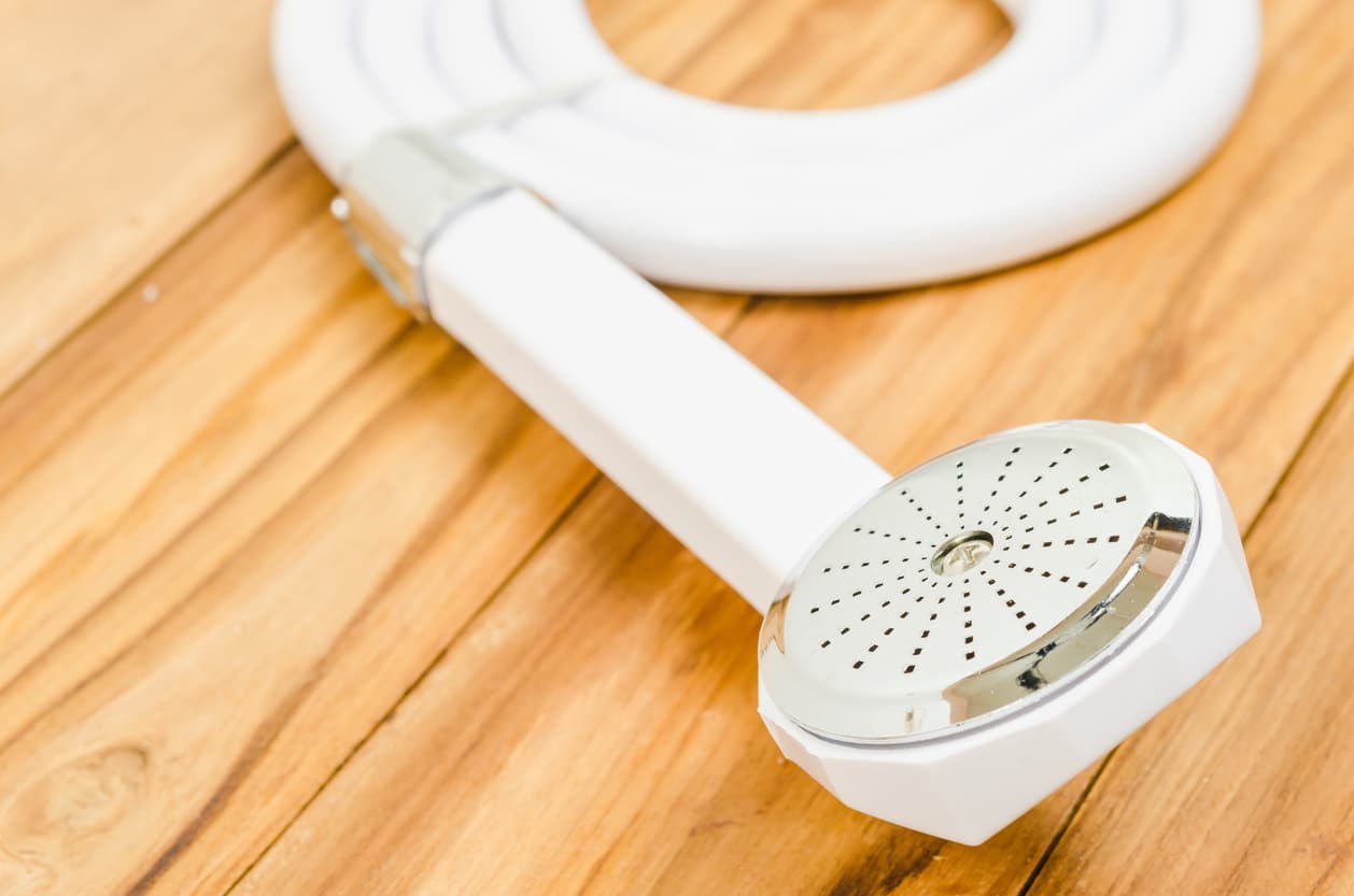 selective focus at shower head put on wood