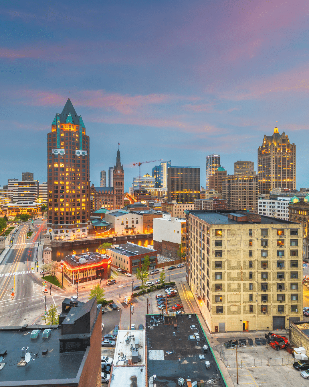 A crew in uniform installing a wheelchair ramp outside of a homeowner's front door