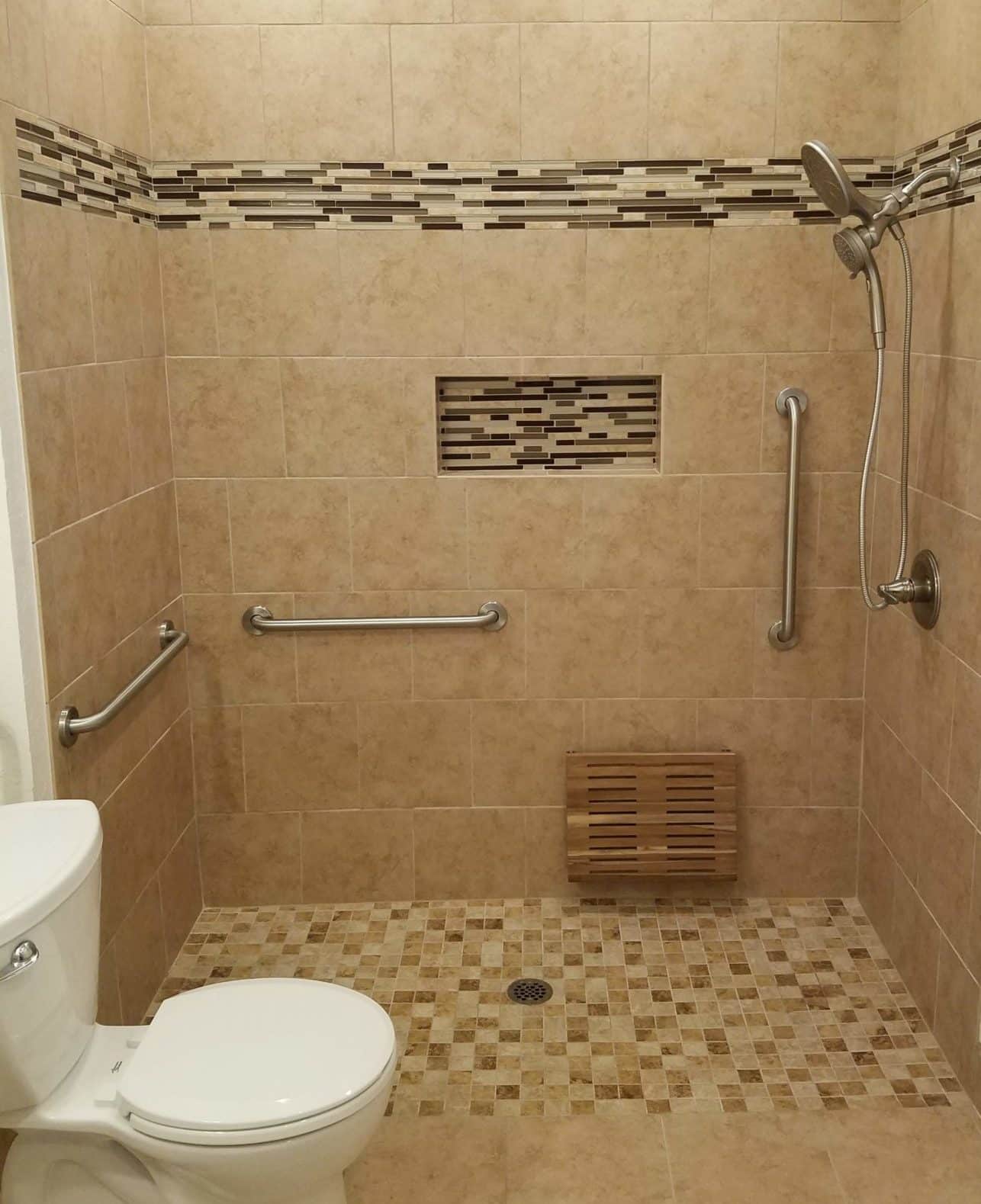 multiple handrails installed in a tile shower at different angles and heights
