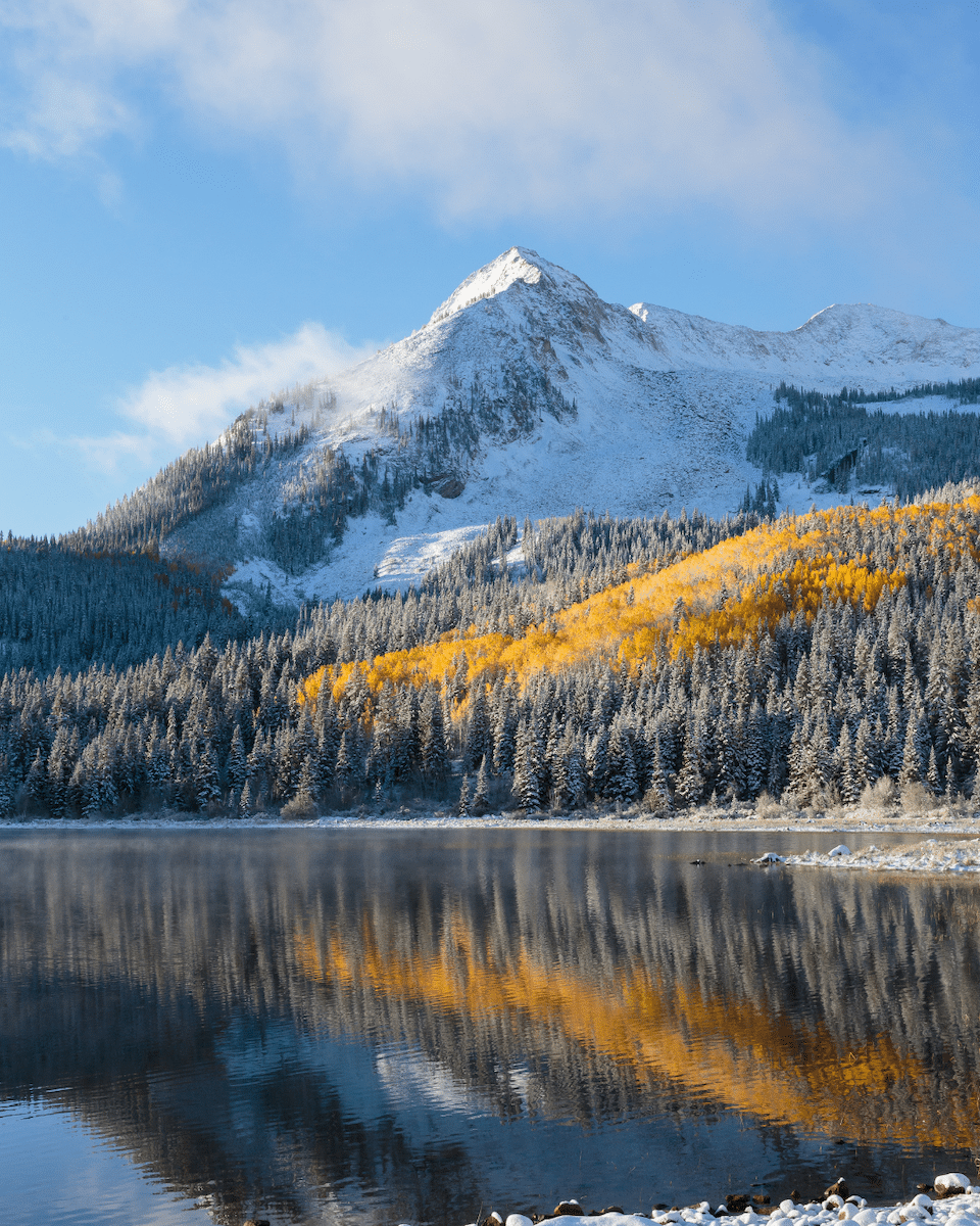 A crew in uniform installing a wheelchair ramp outside of a homeowner's front door