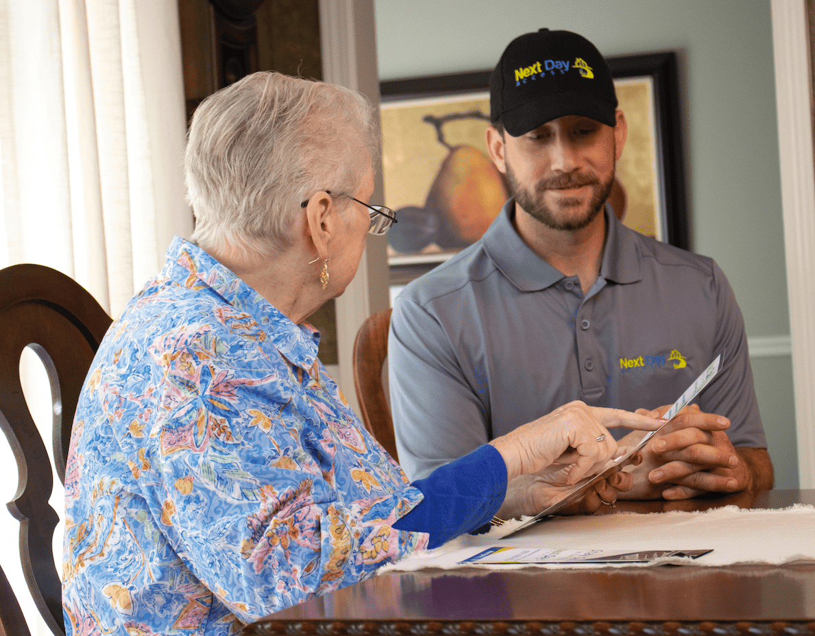 man sits with older woman planning a project