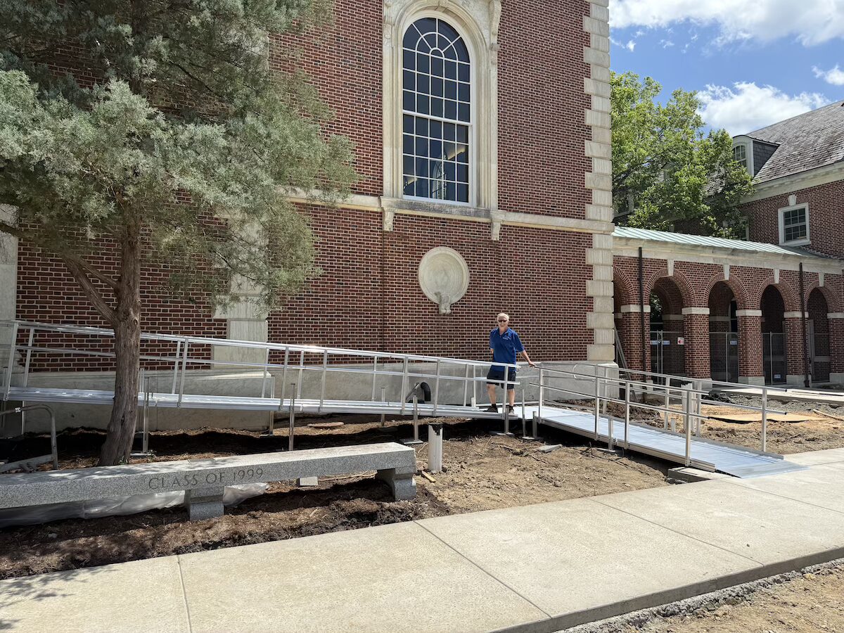 Next Day Access work van parked on campus during a modular aluminum wheelchair ramp installation at Duke University.