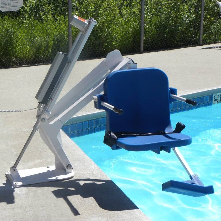A closeup of a blue commercial pool lift hovers over a swimming pool