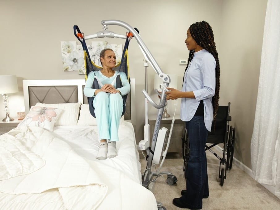 A group of four Next Day Access employees smile at the bottom of a small staircase