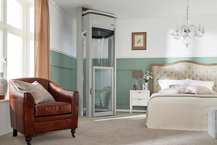 A personal elevator installed along the wall of a home