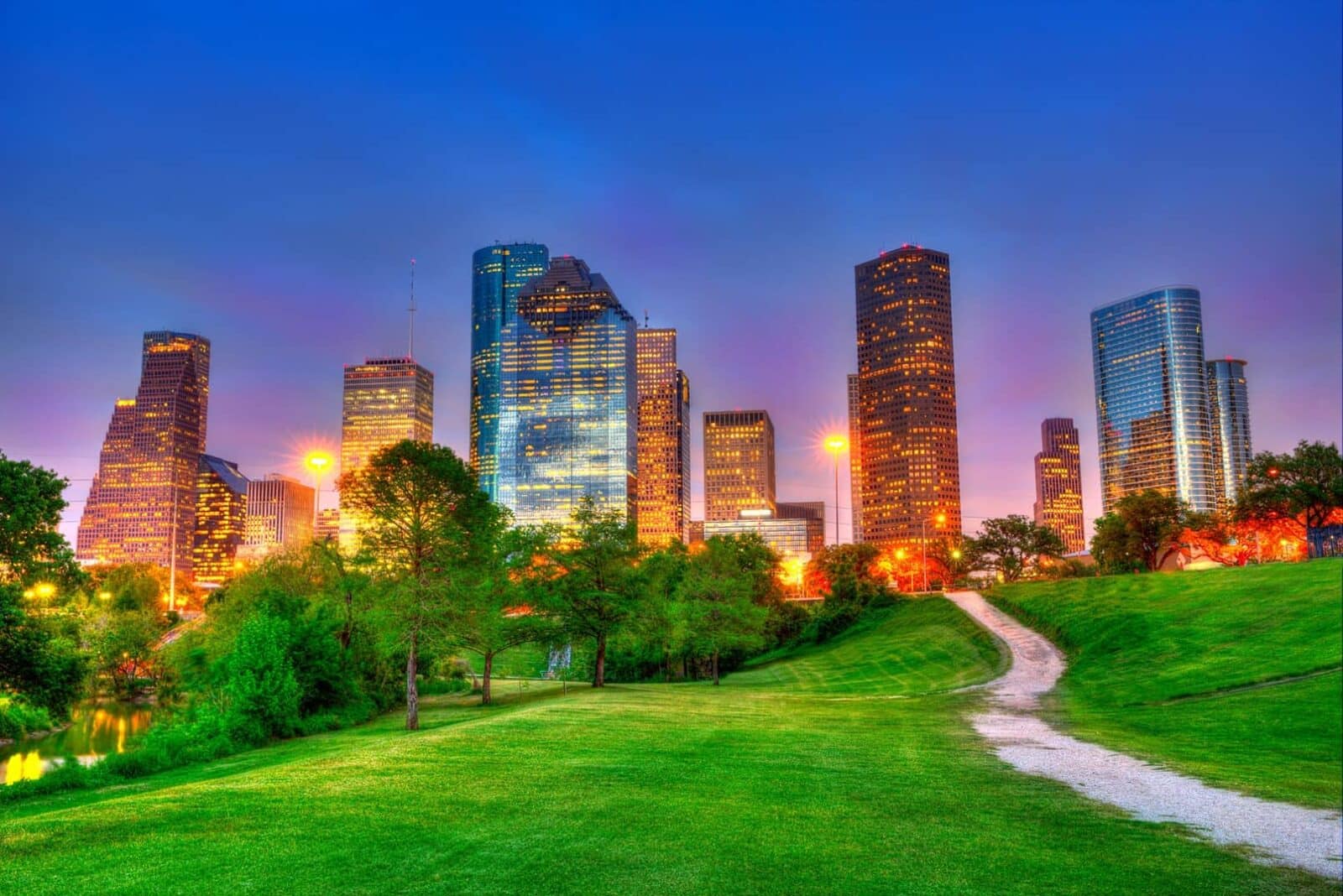 green hills in front of the houston skyline