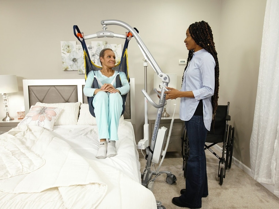 A group of four Next Day Access employees smile at the bottom of a small staircase