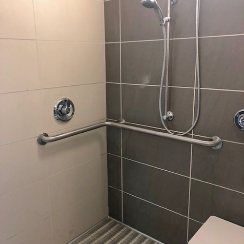 shower with a grab bar installed