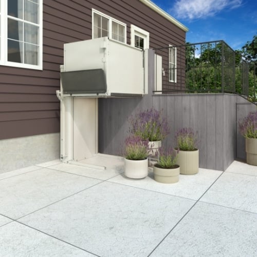 A raised porch with a steel lift installed and raised to be level with the front door