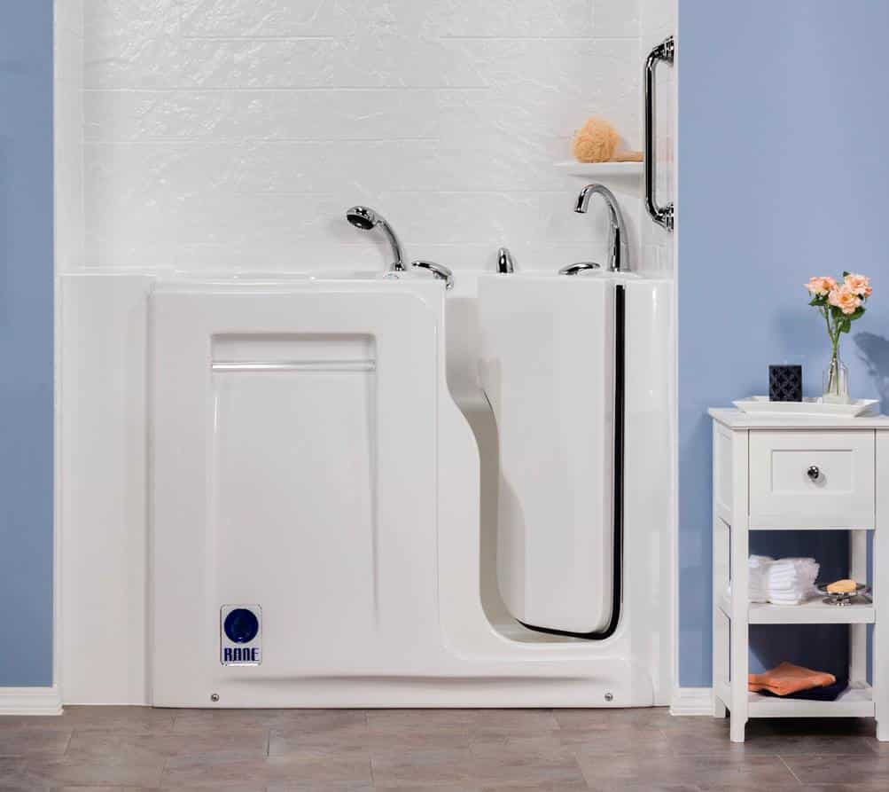 A walk in tub in a bathroom with blue painted walls