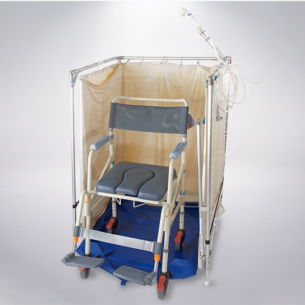 Wheelchair-in-shower a manual wheelchair parked halfway into a square portable shower on a gradient bckground