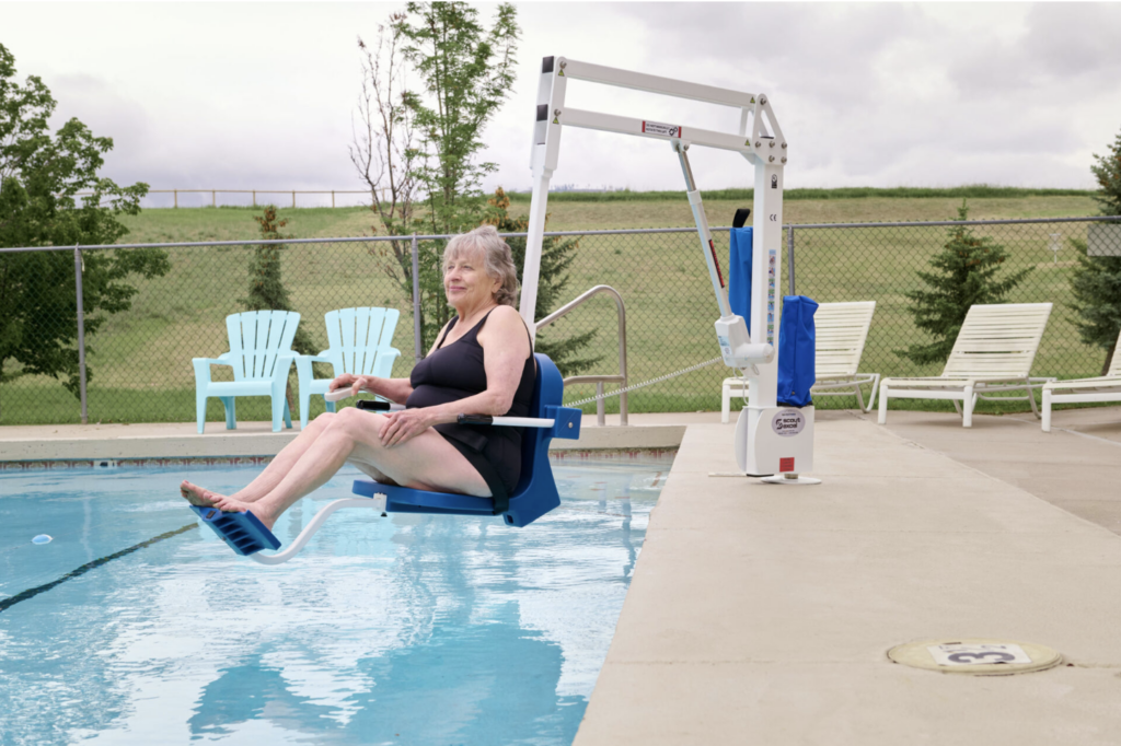 Woman in pool lift