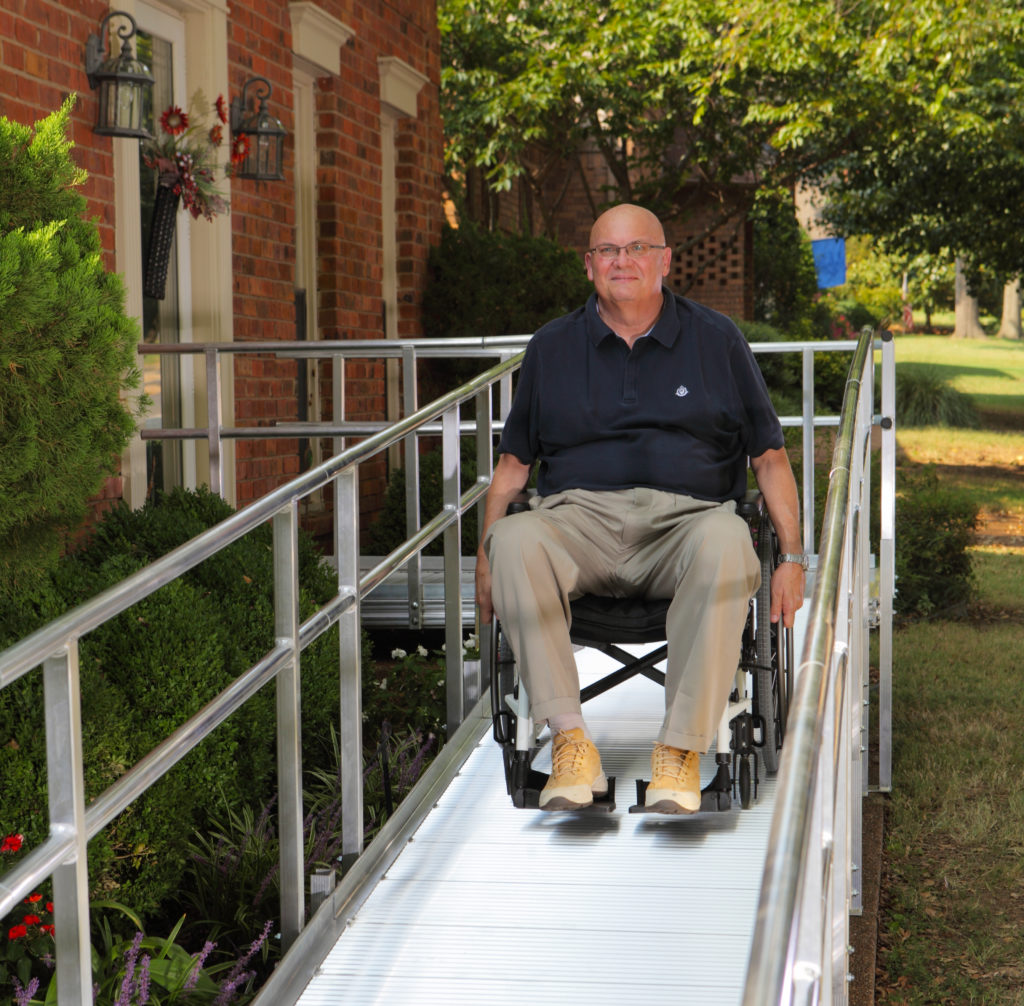 Mental Health Day image: Man Using An Aluminum Wheelchair Ramp